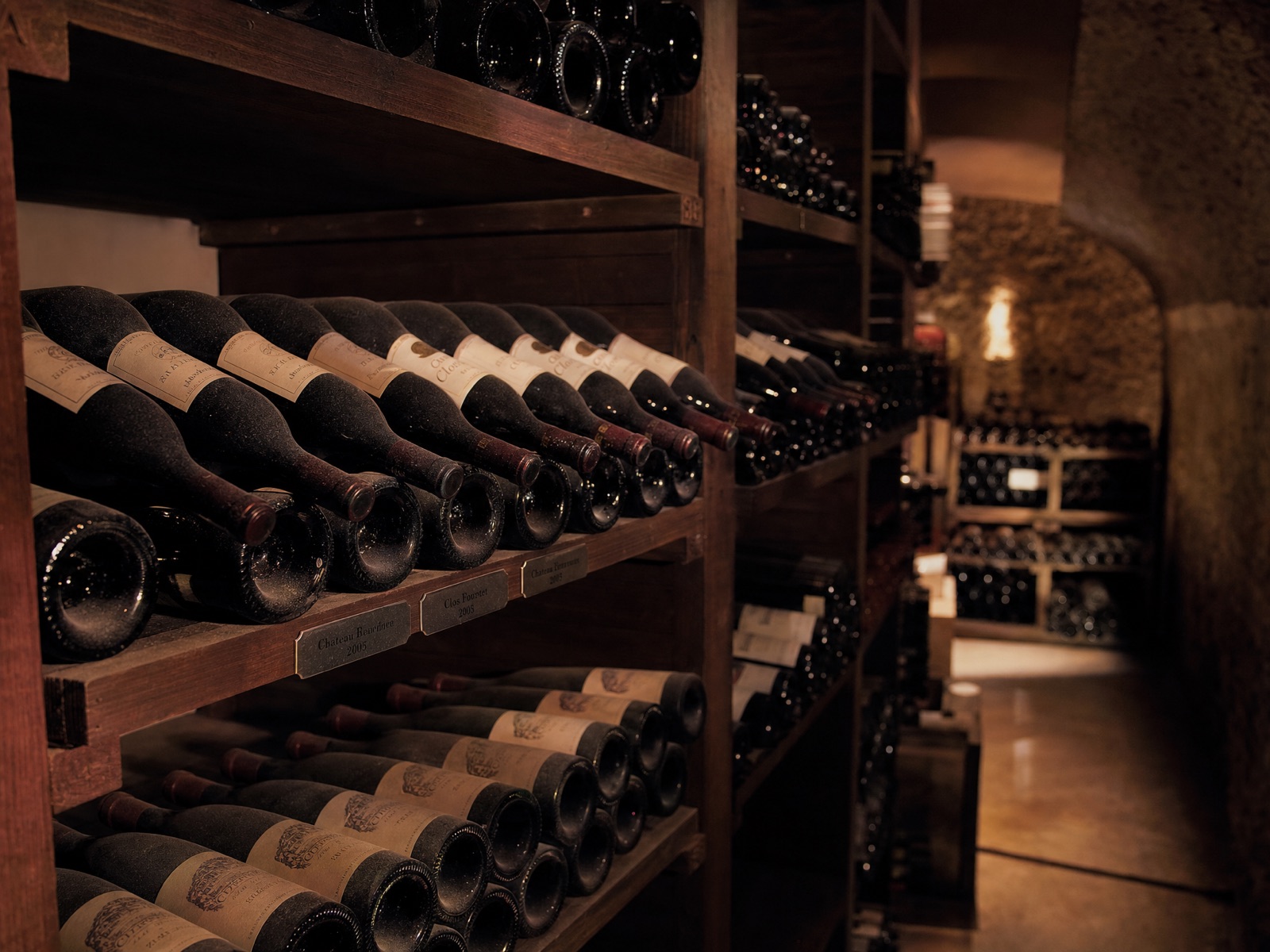 Fine wine aging in a dim private cellar