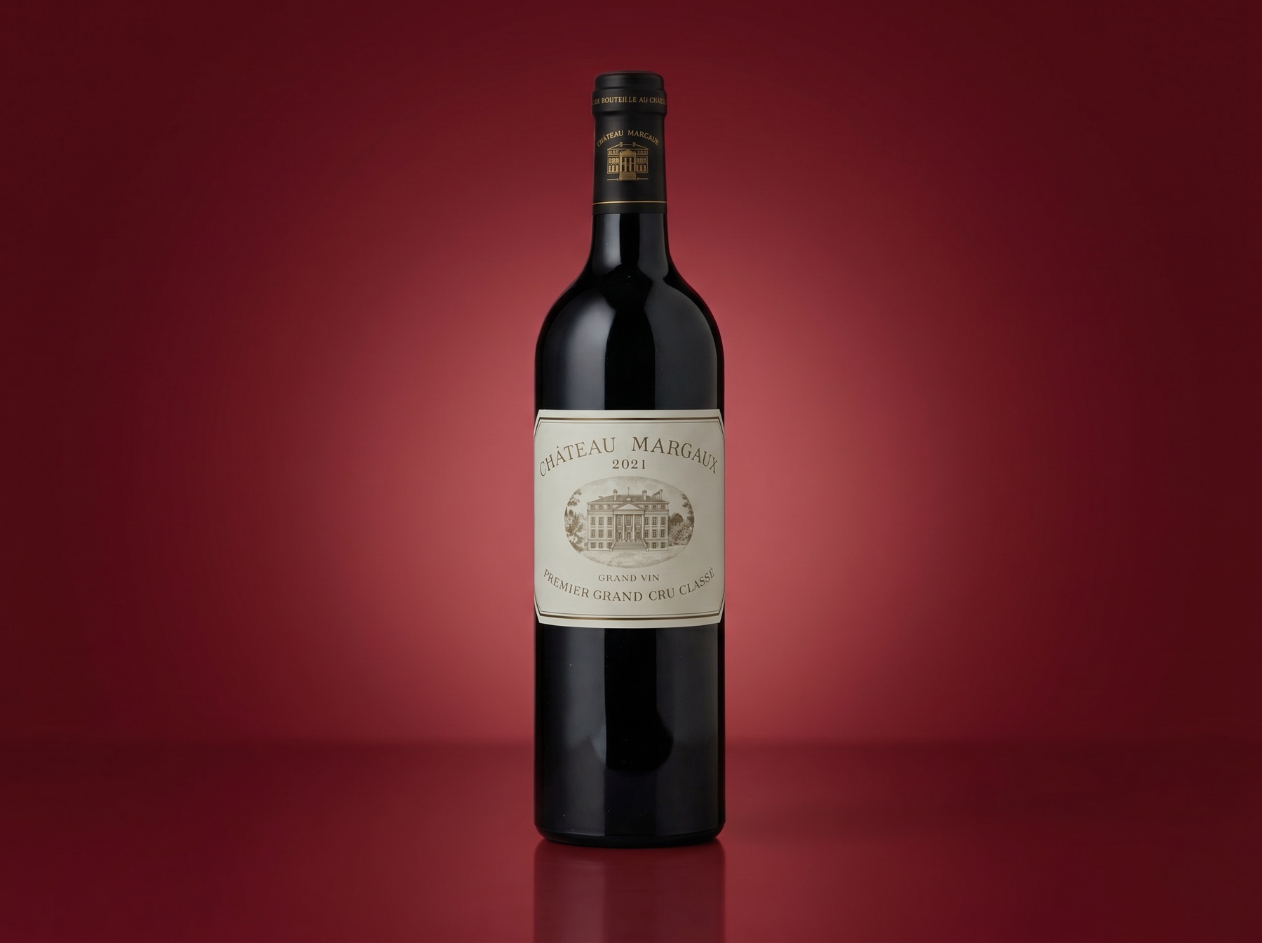 Château Margaux - a fine red-wine bottle on a deep wine-red background